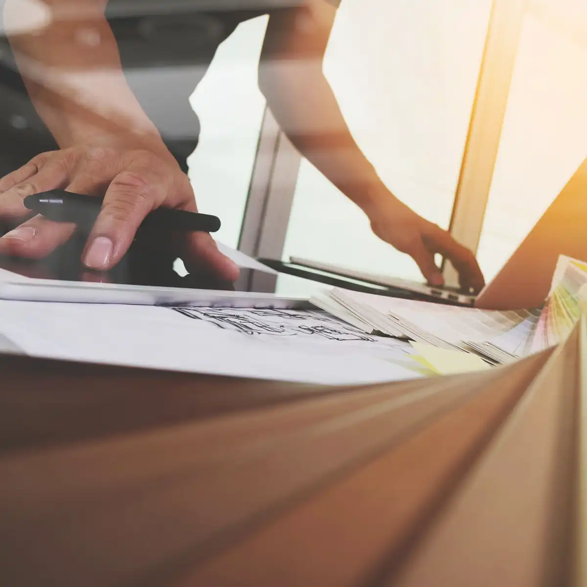 Designer reviewing sketches and digital concepts during a one-on-one project process at our Sunshine Coast design studio.