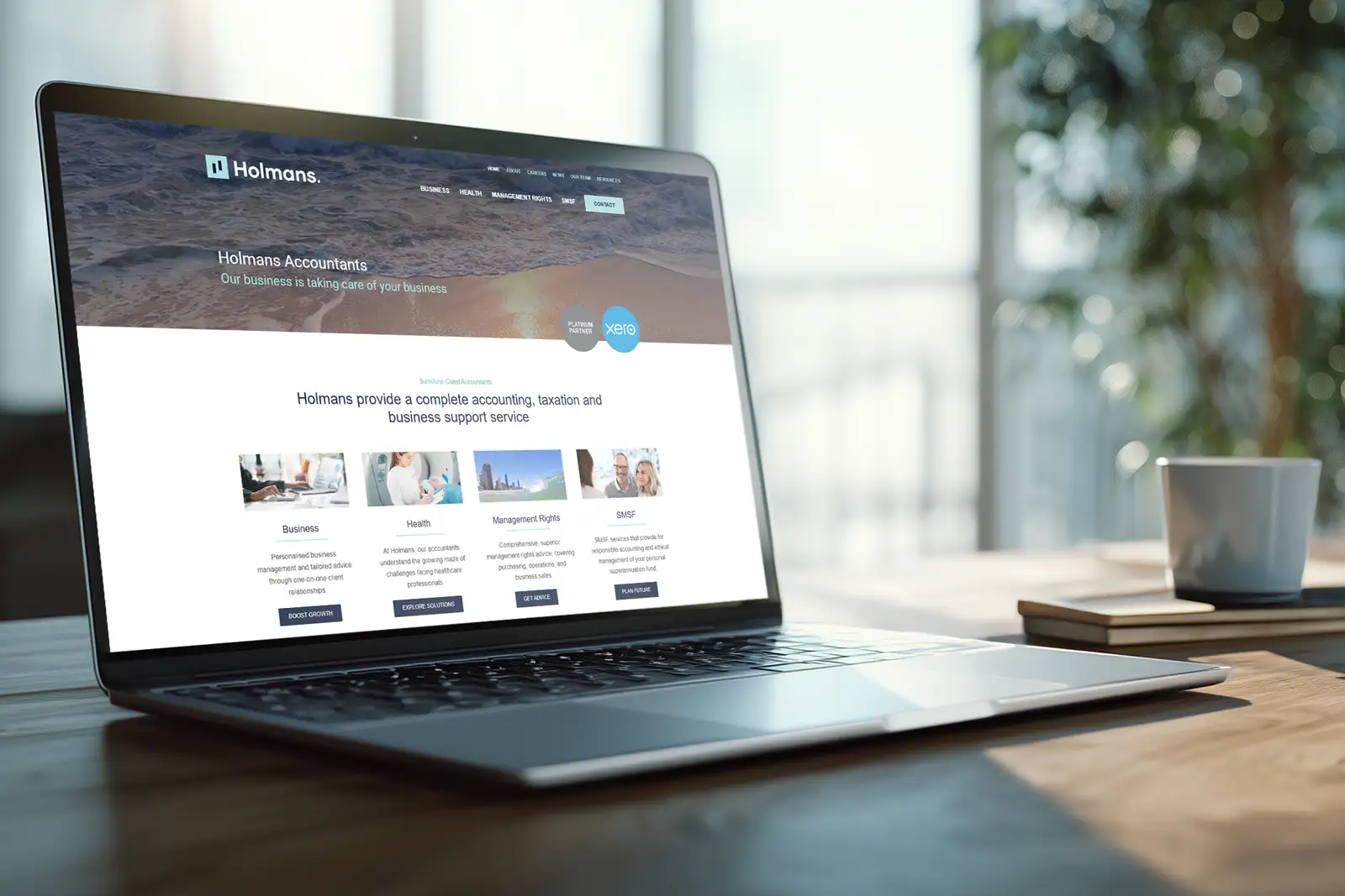 Accounting website design for Holmans displayed on laptop screen