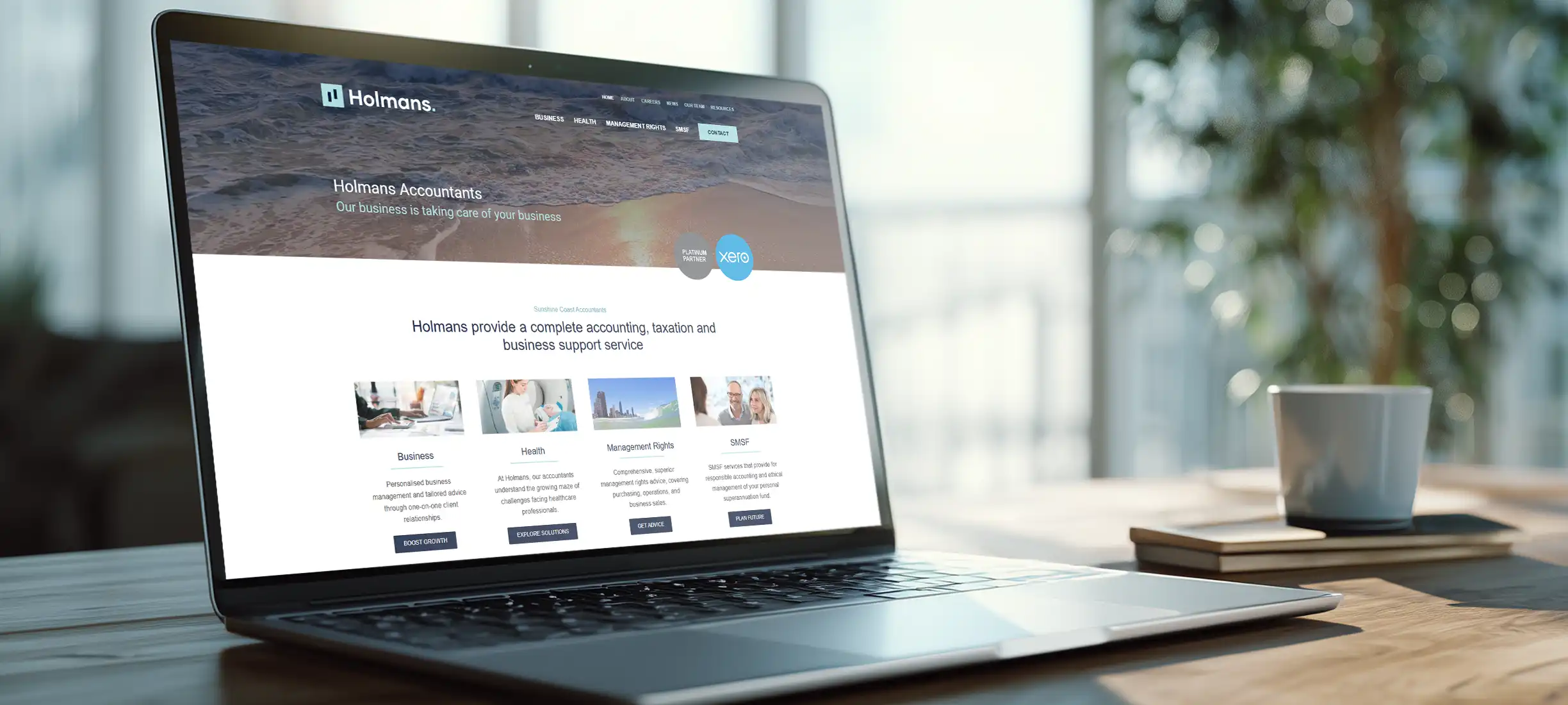 Holmans accountants website design displayed on laptop screen