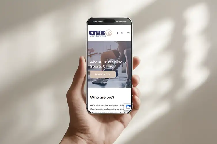 Crux Spine & Sports Clinic Website Design – Mobile View Crux Spine & Sports Clinic website design displayed on mobile device